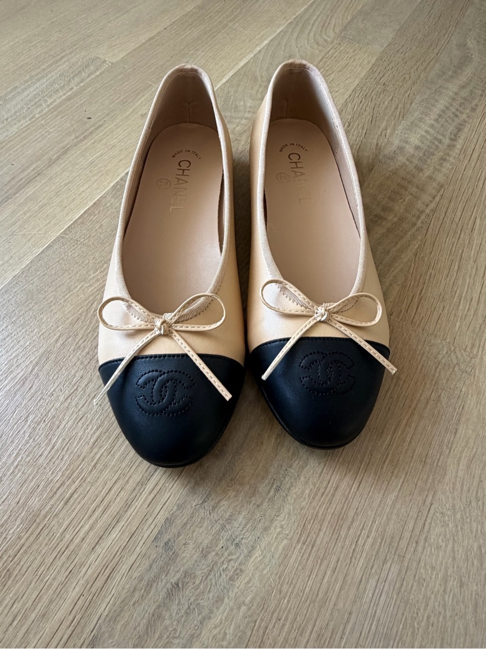 CHANEL Two-Tone Beige and Black Cap-Toe Ballet Flats